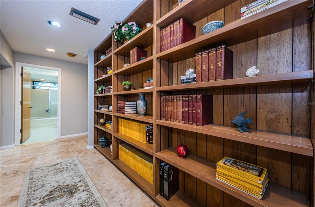 Wide hall to split two bedroom wing offers immense storage/book shelves.
