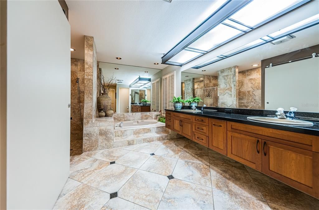 Huge master bath with expansive shower and separate whirlpool tub.