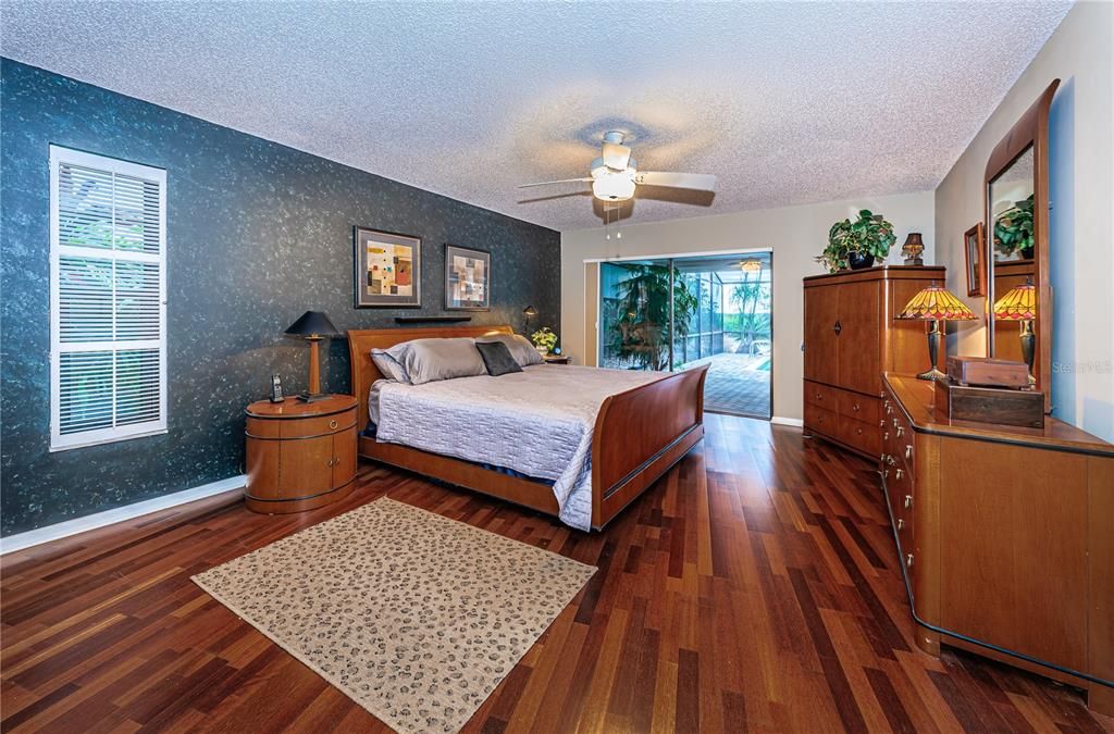 Large master suite overlooks the pool and waterfront.