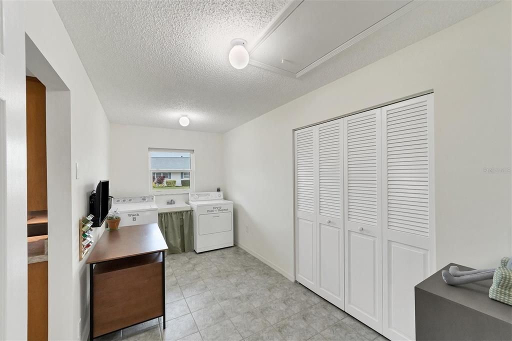 Laundry room with extra closet space and room for craft table!