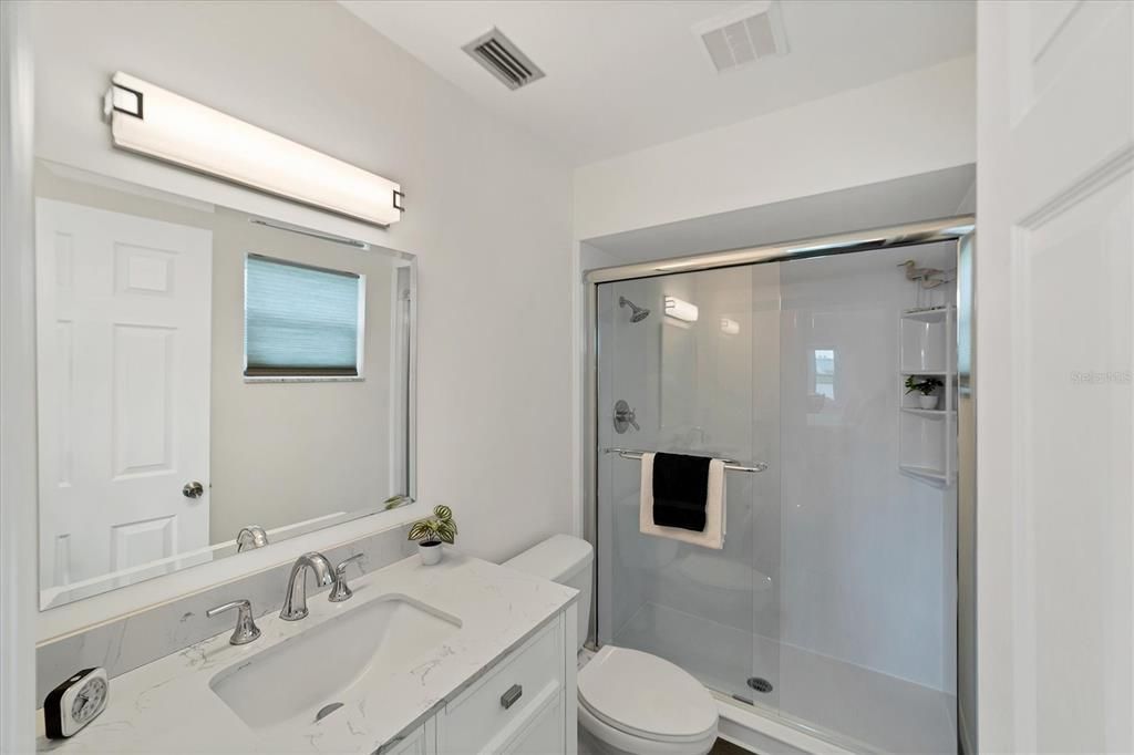 Updated en suite with new vanity and glass enclosed shower!