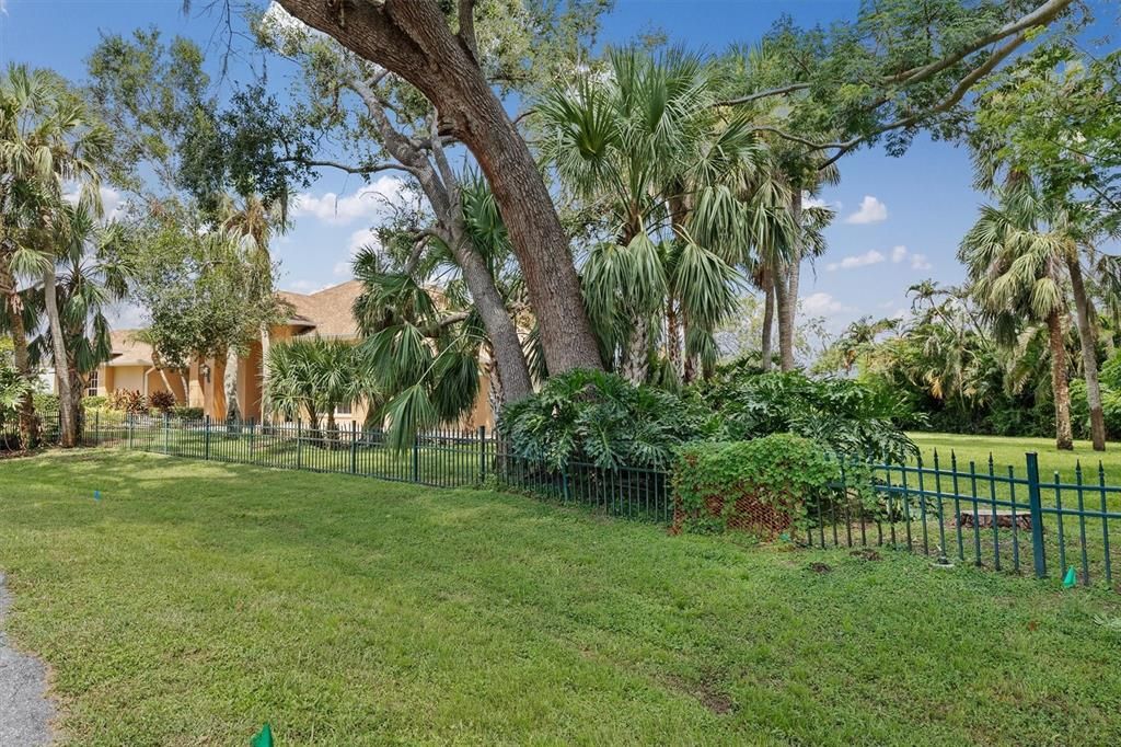 Mature oaks and palms adorn this property.