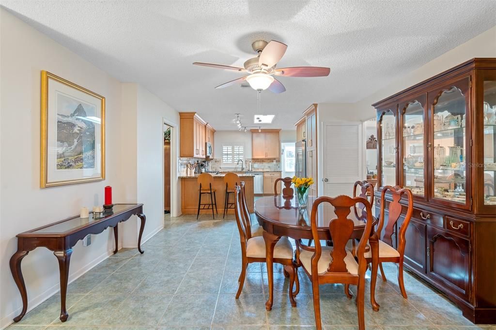 Dining area leads into open kitchen.