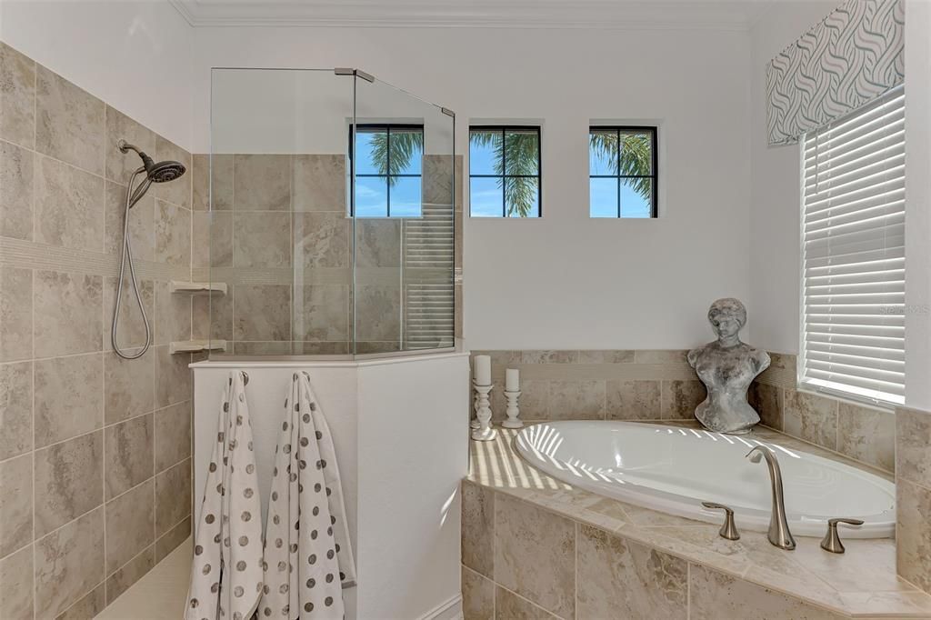 Ensuite Bath has private shower, tub, and water closet and his and her vanities