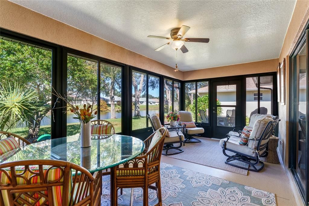 The spacious Lanai overlooks the pond and has sliding withdows and screens