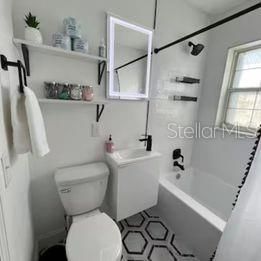 newly remodeled bathroom with LED mirror