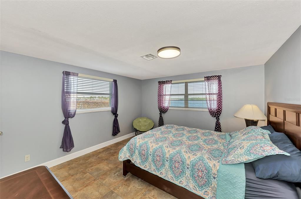 BEDROOM 1 IN THE ATTACHED RENTAL HOME.  NOTE THE VIE FROM THE WINDOW.