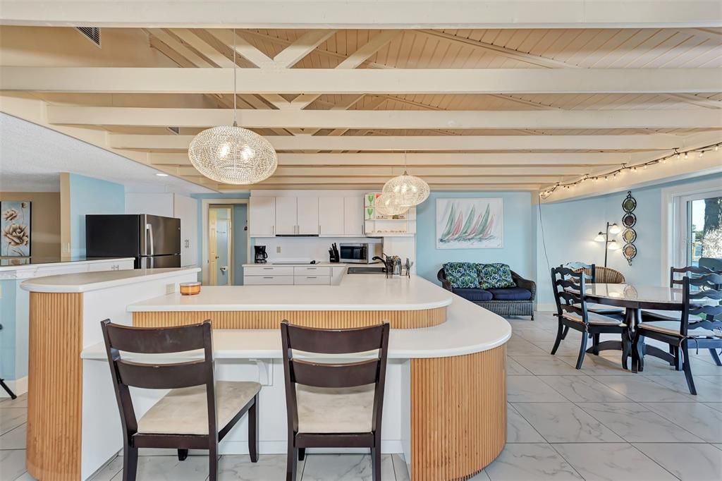 OVERLOOKING THE KITCHEN, IN THE FAR LEFT CORNER IS THE DOORWAY TO THE BEDROOMS.