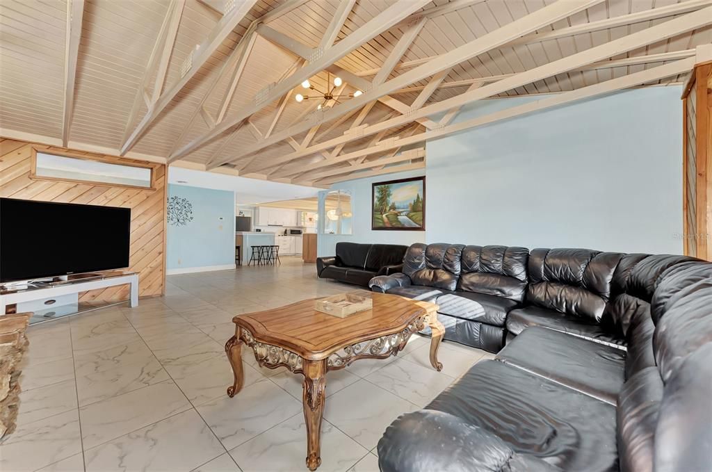 STANDING IN FRONT OF THE FIREPLACE, YOU ARE LOOKING TOWARDS THE KITCHEN.