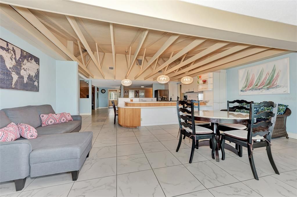 LARGE FAMILY ROOM, KITCHEN AND IN THE DISTANCE THE FORMAL DINING ROOM.