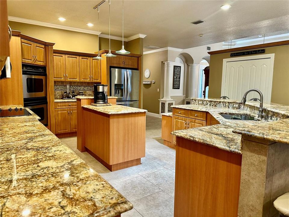 Chef's kitchen with granite countertops & large island