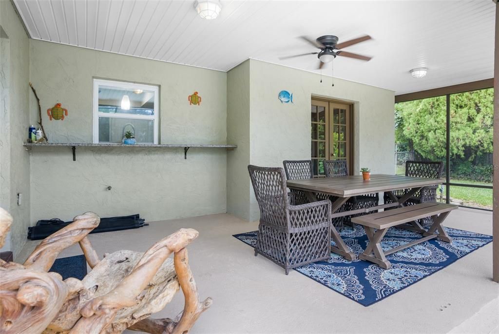 Covered lanai overlooking the pool