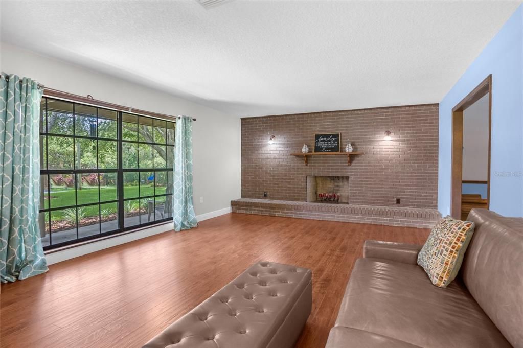 Living room with wood burning fireplace