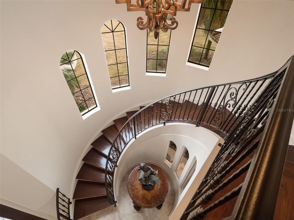 FORMAL CURVED STAIRS IN FOYER UP TO SECOND FLOOR
