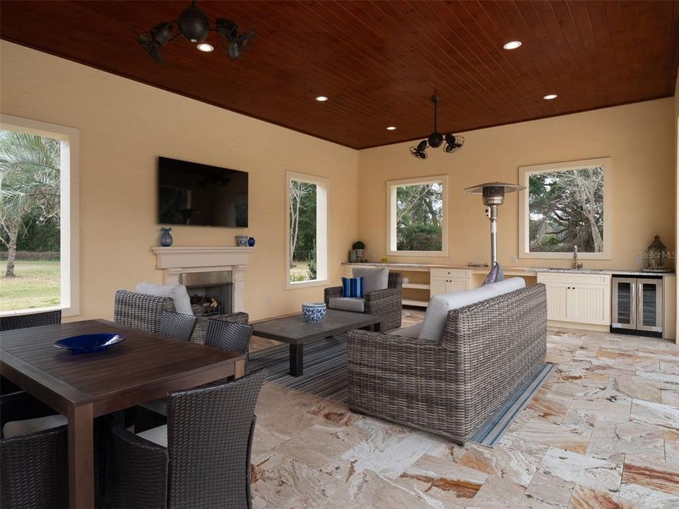 INSIDE LARGE POOL HOUSE WITH GAS FP, TONGUE AND GROOVE CEILING AND SERVING BAR
