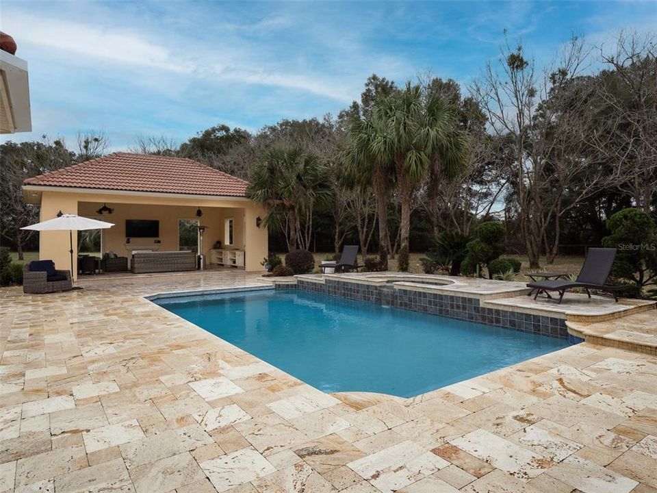 STUNNING OUTDOOR AREA, TRAVERTINE PAVERS, POOL/SPA AND NEWER POOL HOUSE