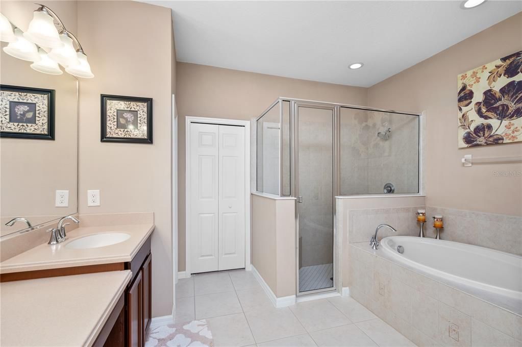 Large primary bath with double sinks, soaking tub and private toilet