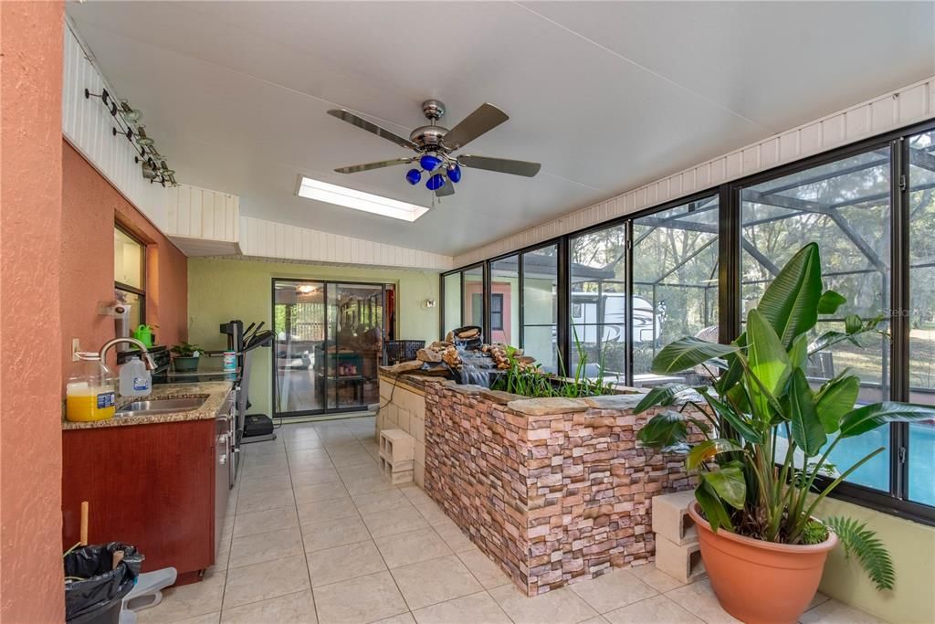 Lanai  with Koi Pond and outdoor kitchen