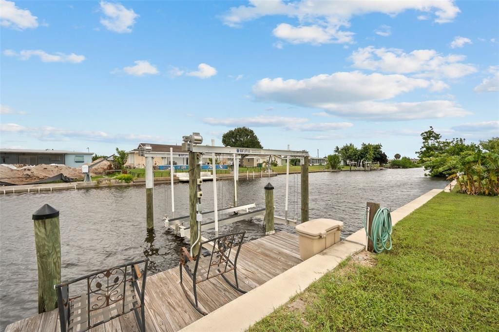 Newer 8000 lb. boat lift at private dock with power and water