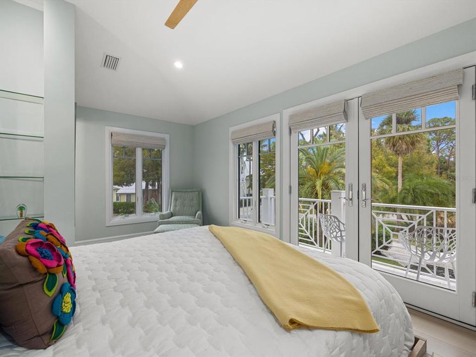 Guest bedroom with a tropical view from balcony