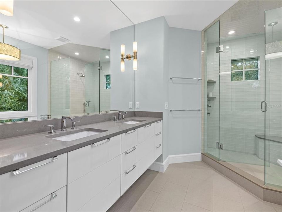 Primary bathroom: glass shower, dual sinks