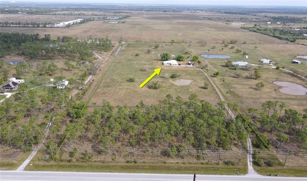 Aerial view of 19+ acres and home