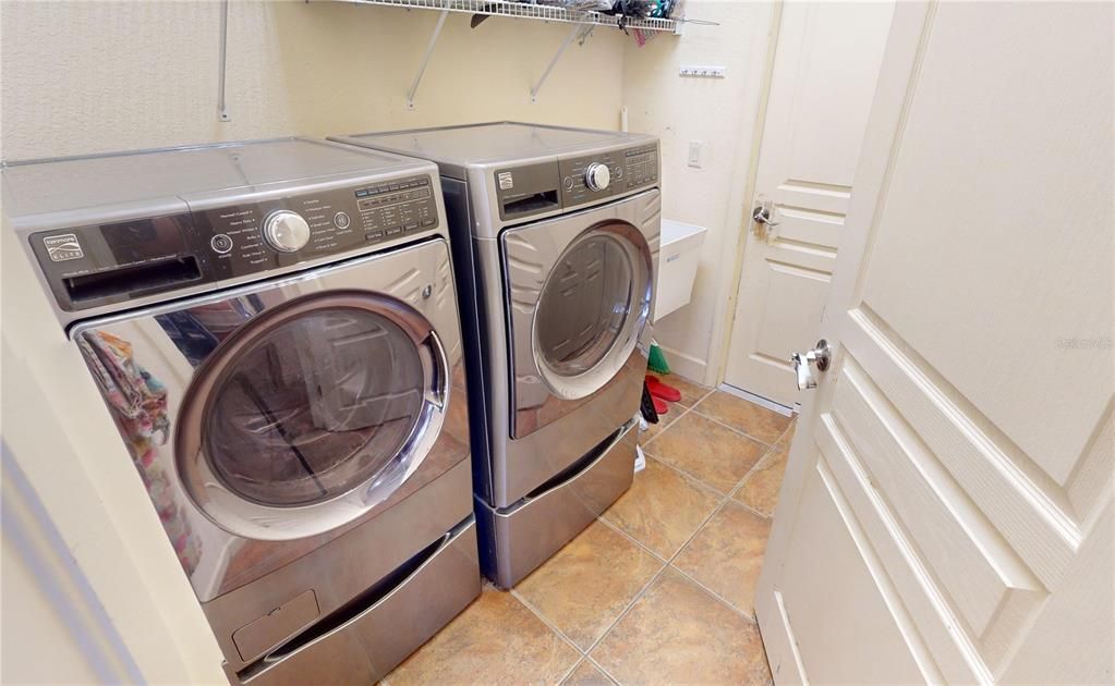 Laundry room off kitchen with garage access