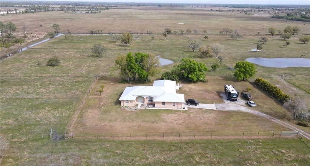 Aerial view of 18+ acres and home