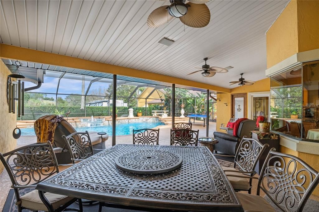 Covered Patio Dining area with Pool view