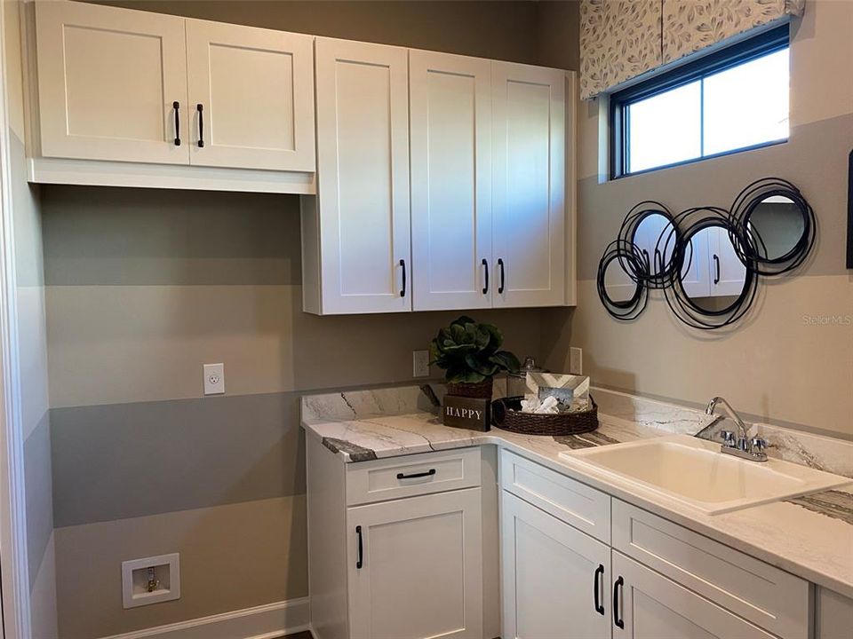 Laundry room w/room for additional refrigerator/freezer