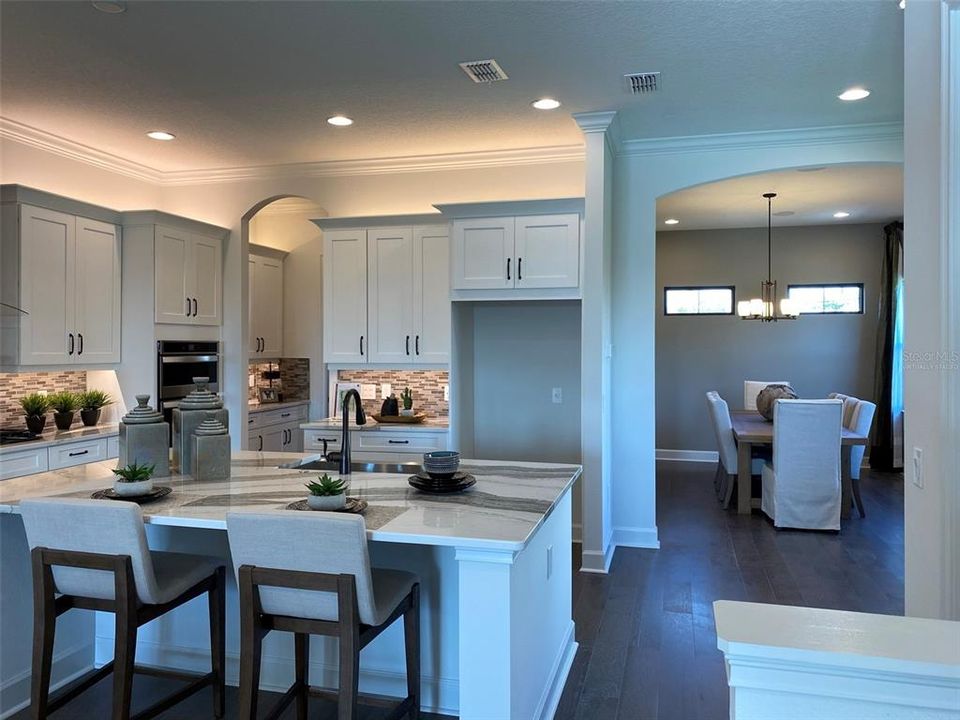 Kitchen now has a built-in stainless steel refrigerator. All appliances are high-end