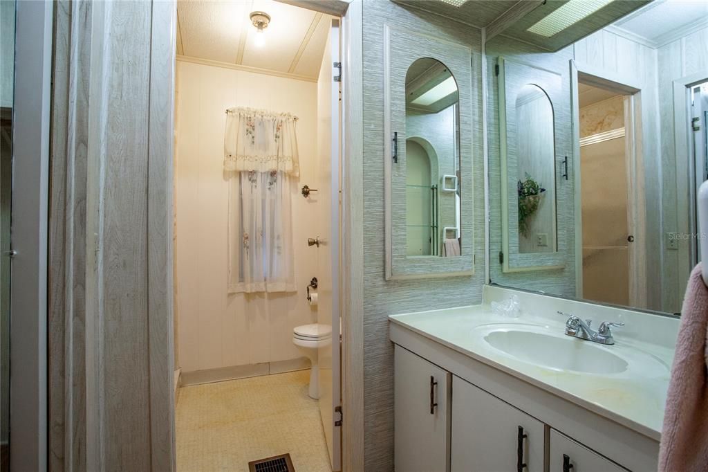 Primary bathroom with separate sink/vanity area