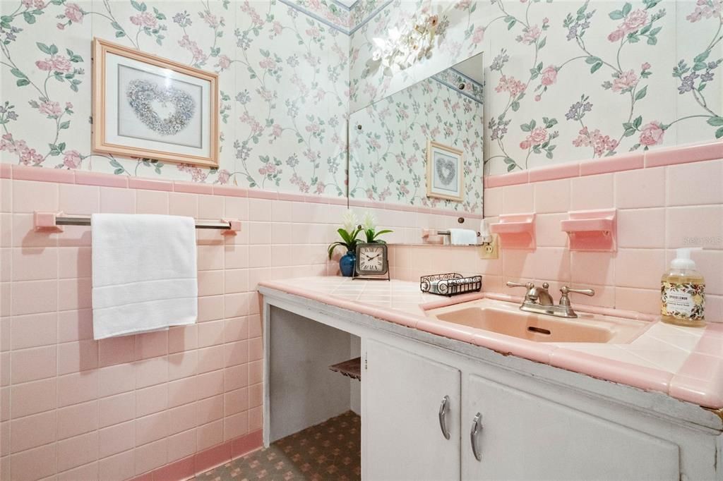 Vintage Master Bathroom. Beautiful Pink and Gray Tile Flooring. Shower with Tub.