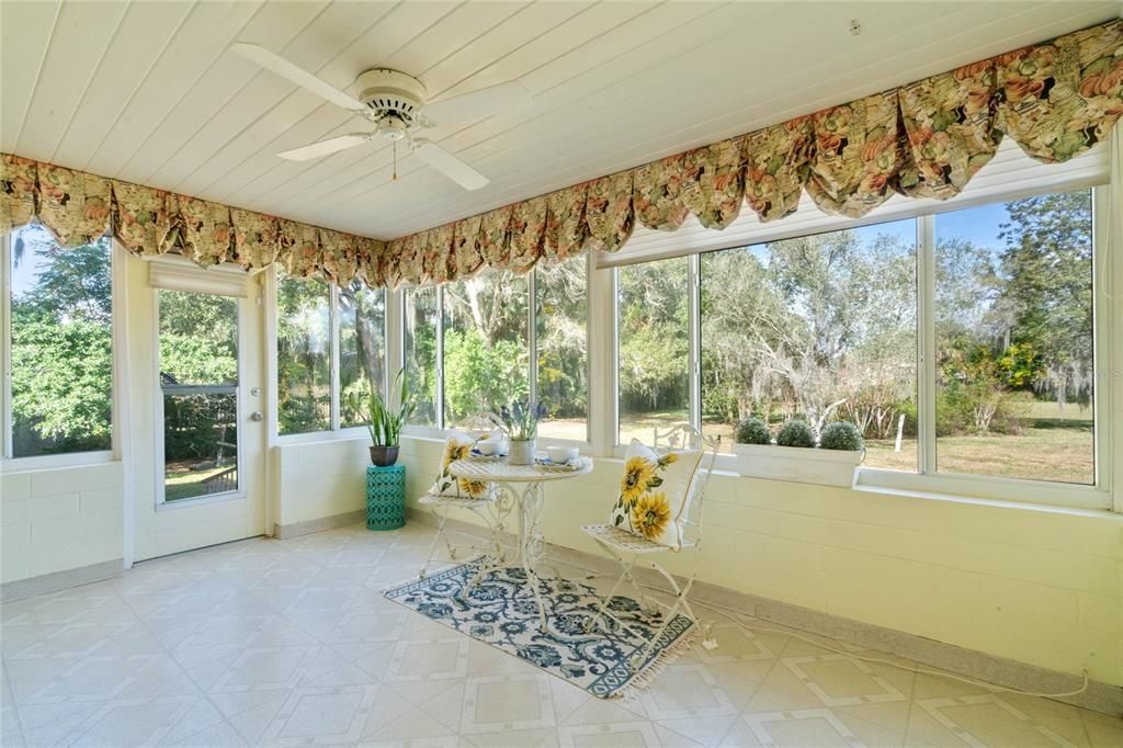 Florida Room Overlooking your 1.05 Acres of Property. Glassed-In, Air Conditioned, and Ceiling Fan.