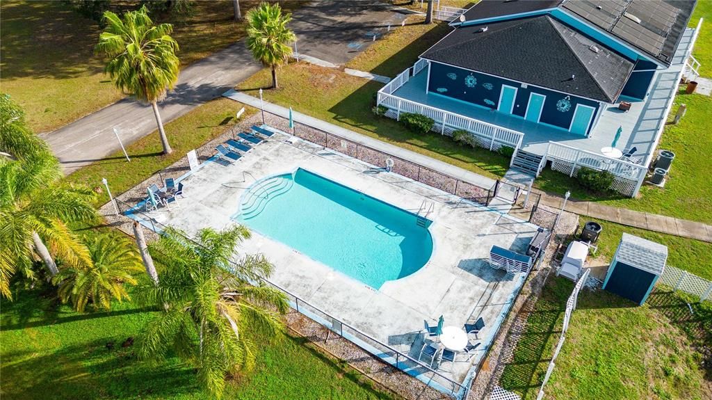 Community offers heated pool, shuffle area, and club house.