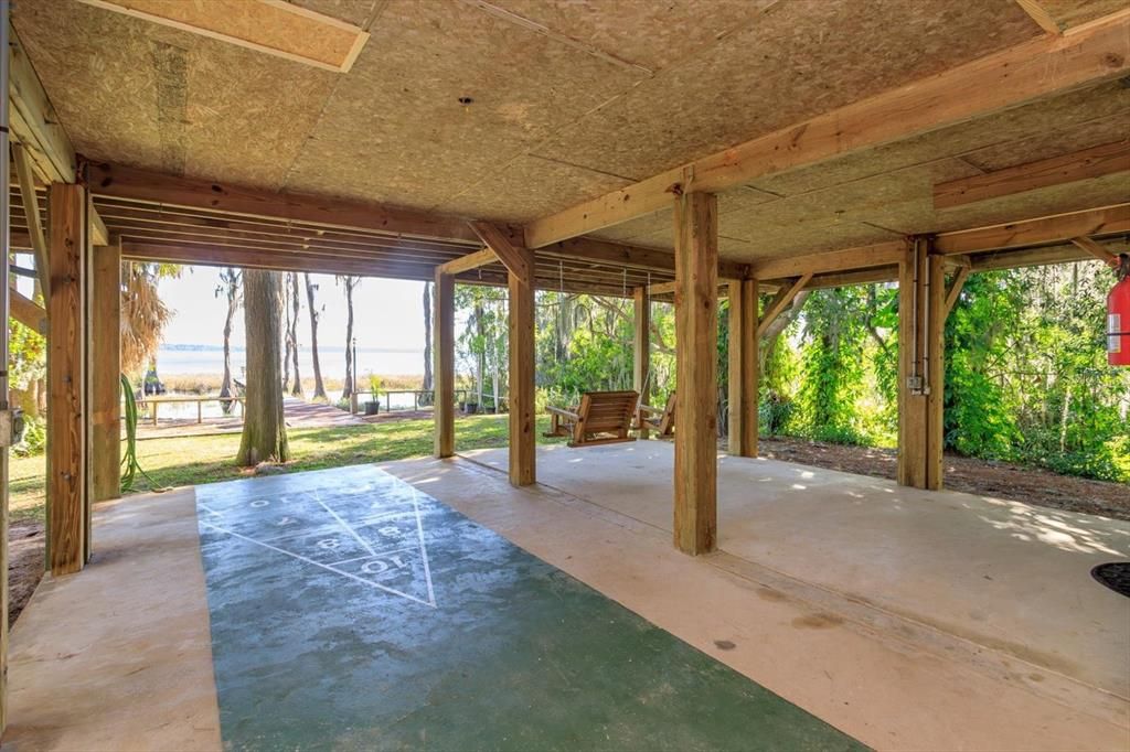First floor covered patio overlooks the lake.
