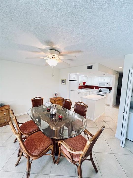 Very charming bright and  airy dining room facing kitchen.