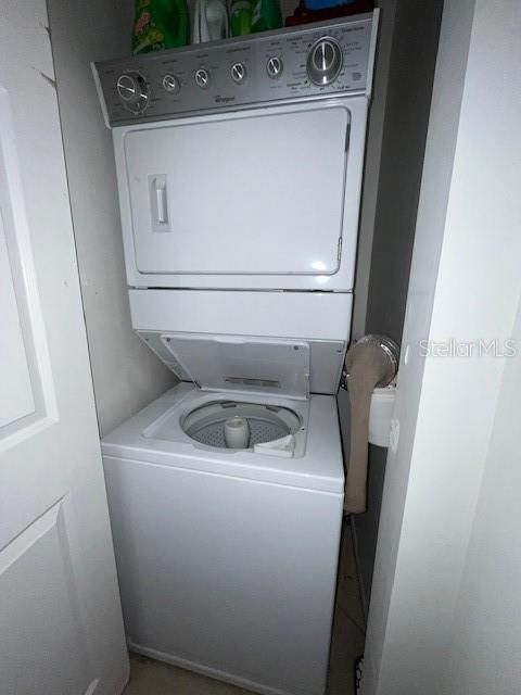 Stacked washer/dryer in its own closable closet