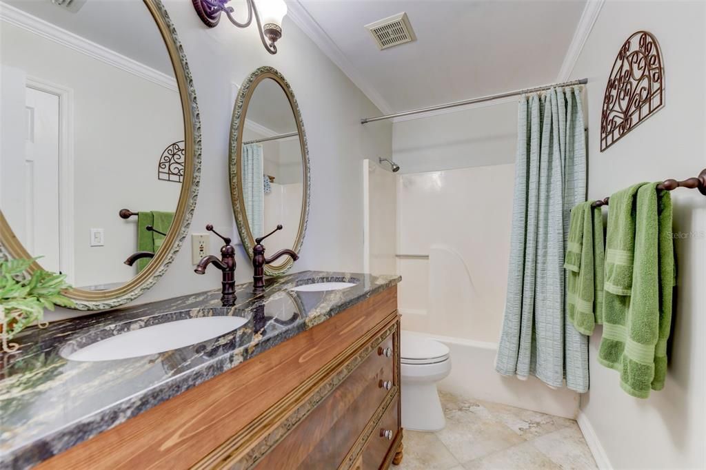 Bathroom 2 with granite counters, gorgeous fixtures and mirrors and tub/shower combo