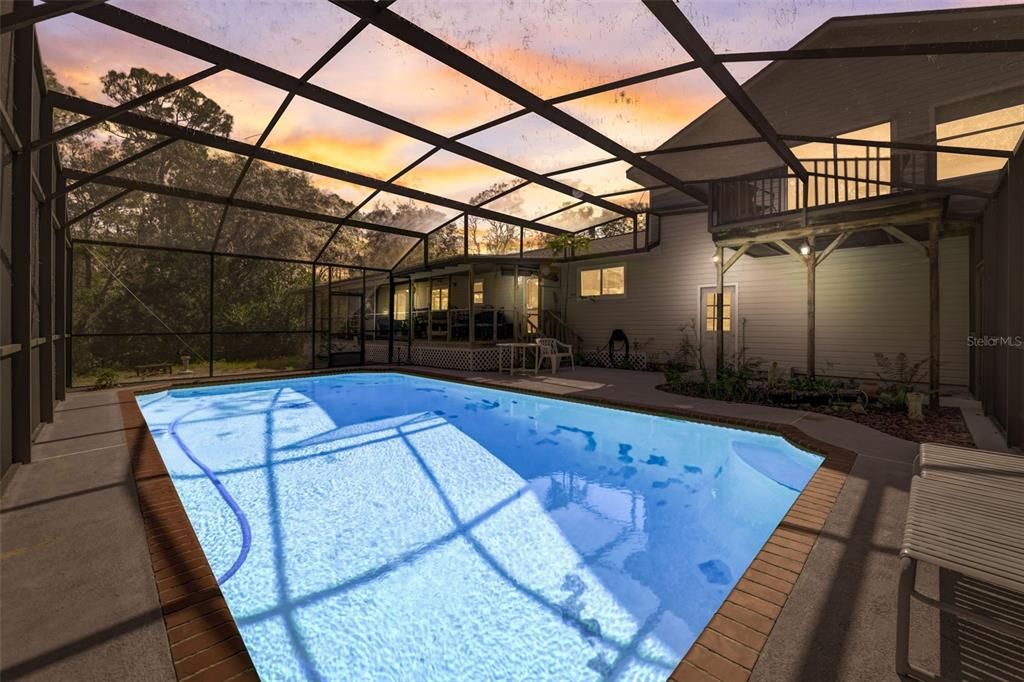 Large screened pool with water view