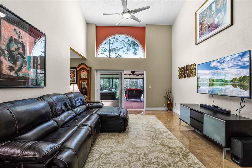 The living area offers tons of natural lighting and double door access to the covered rear patio.