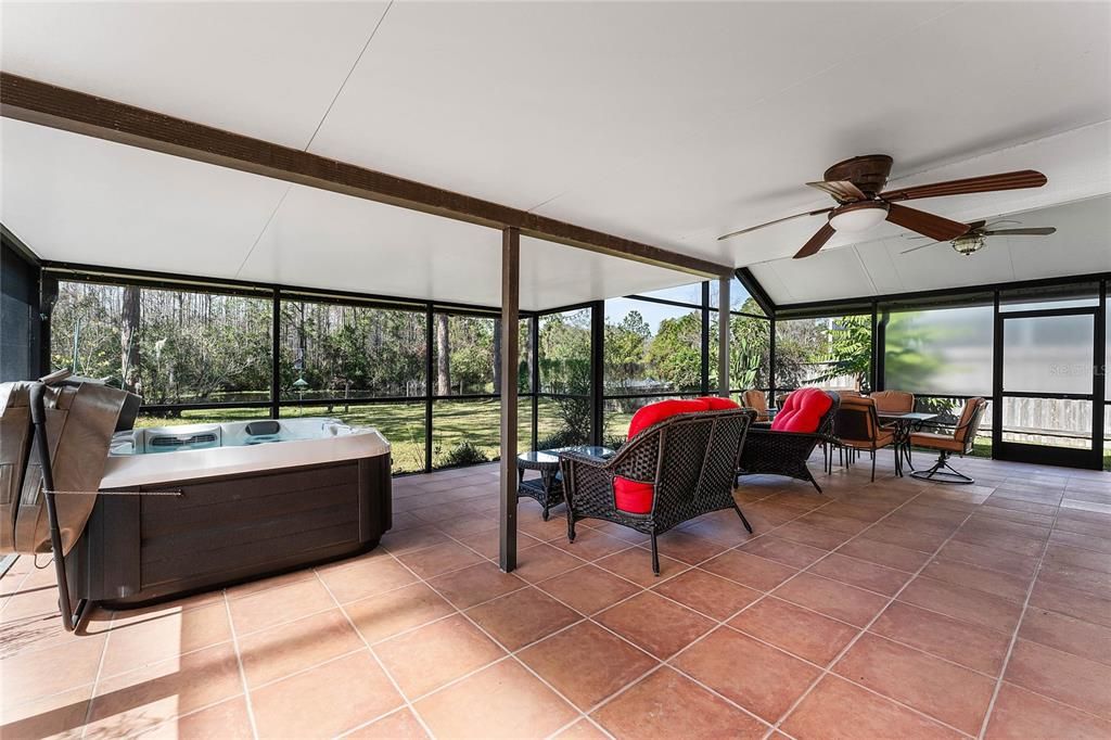 This home features an expansive rear screened and covered patio.