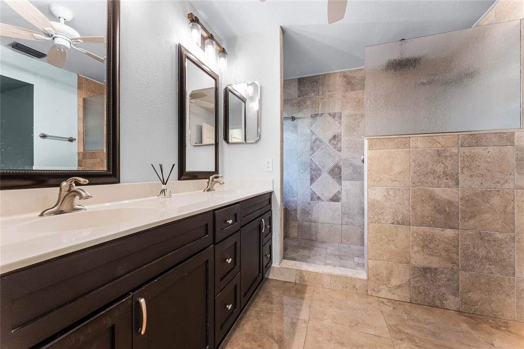 The recently updated master bath offers dual vanity sinks and walk in shower.
