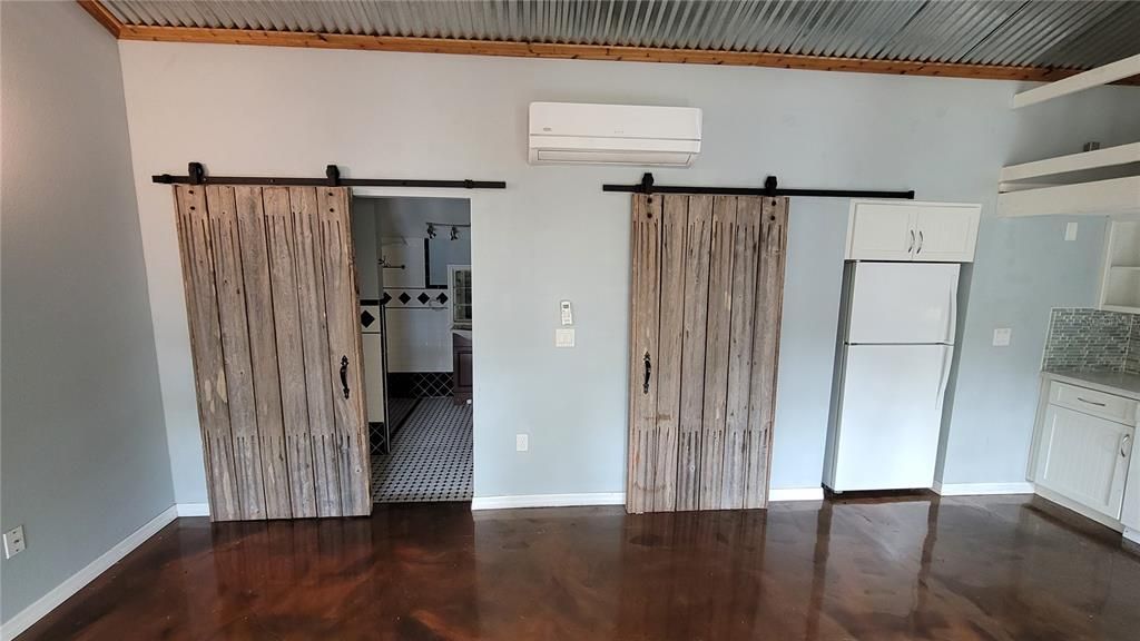 Unit C Barndoors leading to Bathroom and Laundry Room