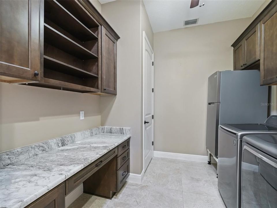 Laundry room / desk and additional storage