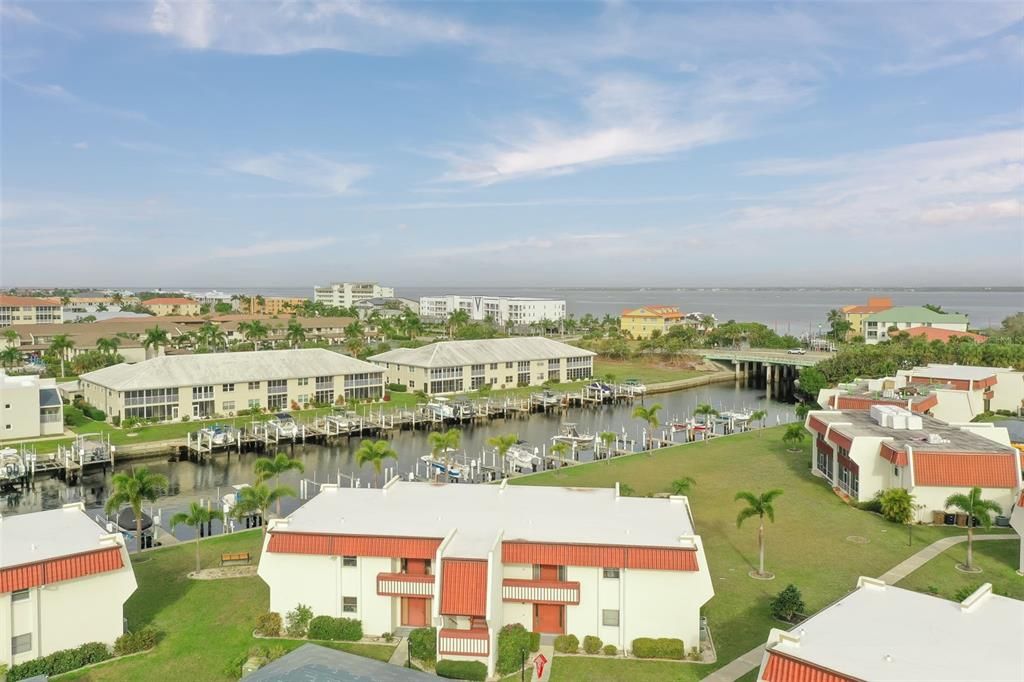 Building 303, shows boat slips that are assigned and deeded to unit owners. Notice how close to the bridge you are, and Charlotte Harbor past the bridge!