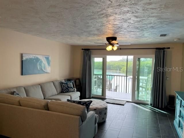 Living Room overlooking bayou and sunseta