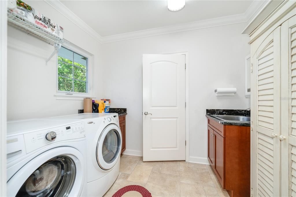 Laundry room is just off the kitchen with Laundry sink