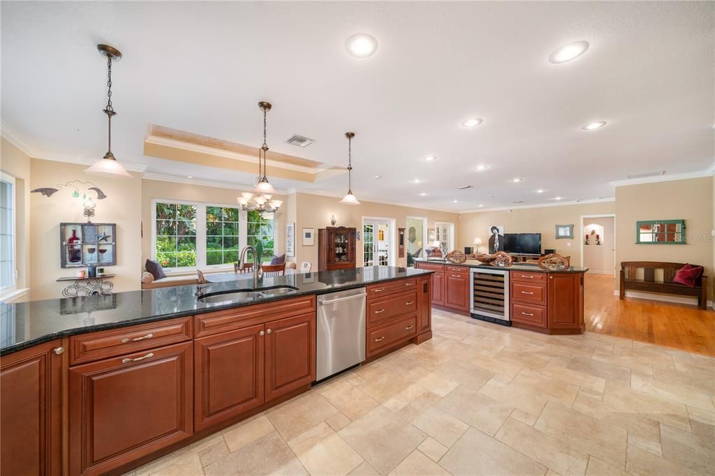 Kitchen Peninsula with view of Wet Bar with wine cooler