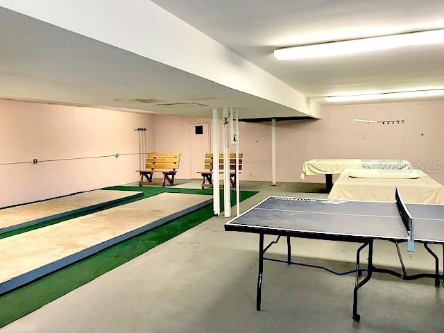 Community recreation room with some fitness equipment